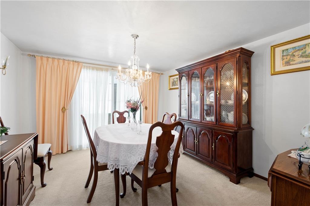 3157 Old Oakdale Road McDonald, PA 15057 - Photo 9 of 39 a view of a dining room with furniture and chandelier