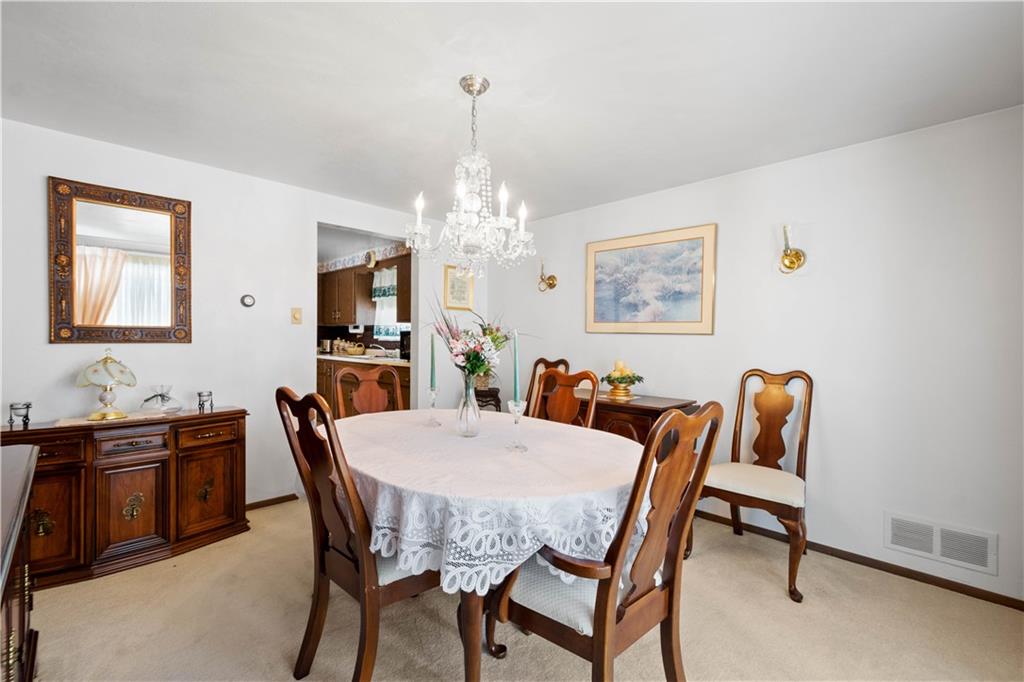 3157 Old Oakdale Road McDonald, PA 15057 - Photo 10 of 39 a view of a dining room with furniture and chandelier