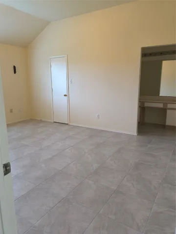 an empty room with a bench