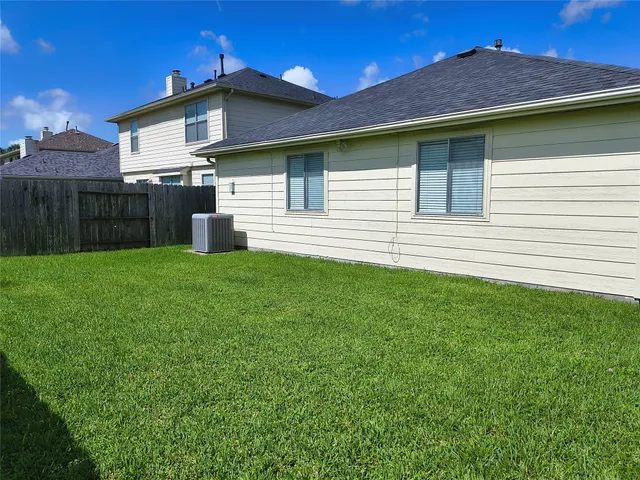 a front view of a house with yard and a garage