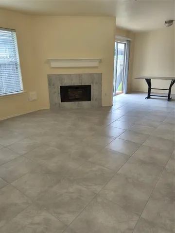 a view of a livingroom with furniture and a fireplace