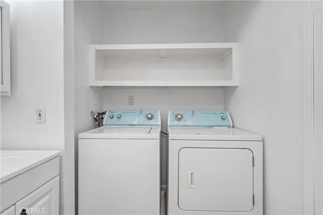 a bedroom with a bed and a table