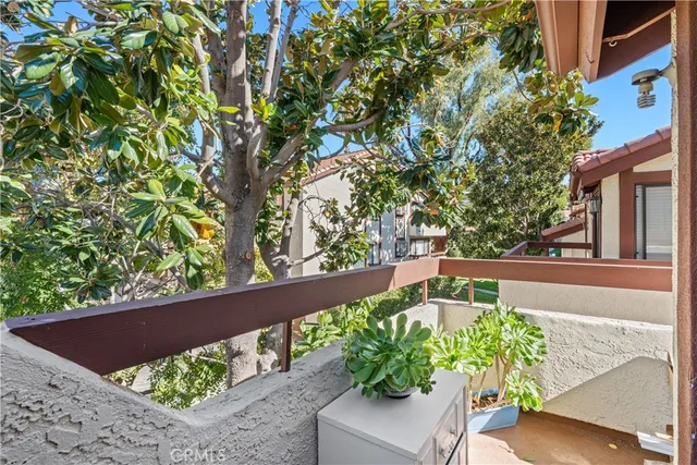 a view of a lake with a flower garden