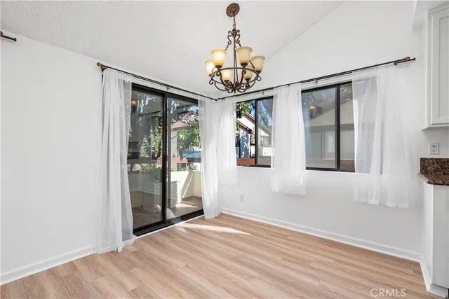 a view of a kitchen with stove and cabinets