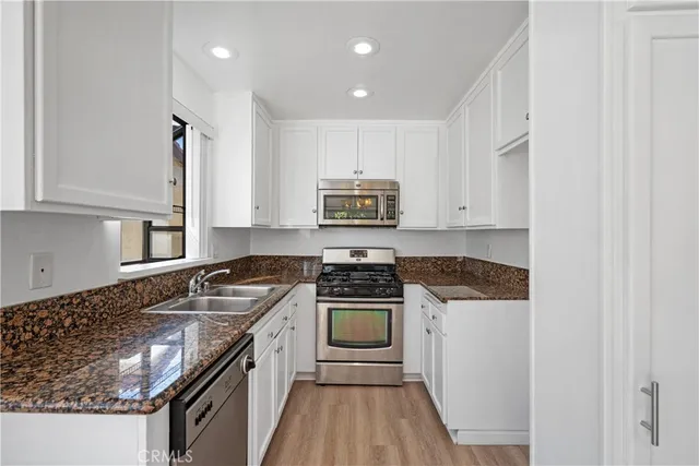 a kitchen with a stove and a sink