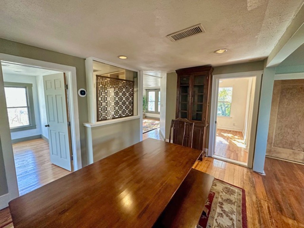 1822 West 35th Street Austin, TX 78703 - Photo 8 of 14 a view of a hallway with wooden floor and windows