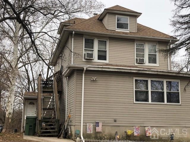 a front view of a house with stairs