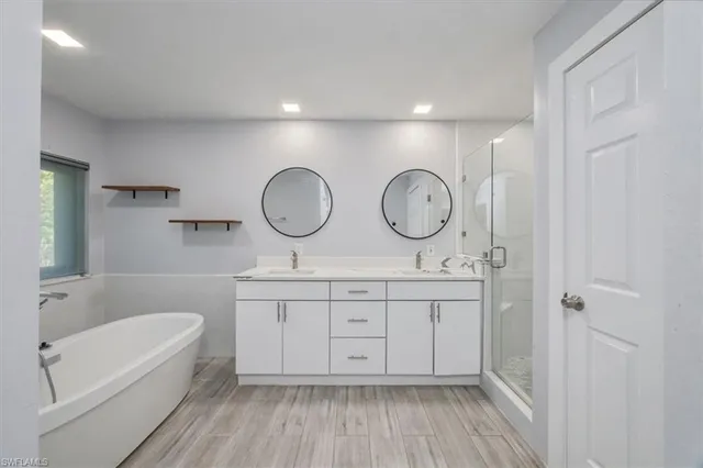 a view of bathroom with dual sinks