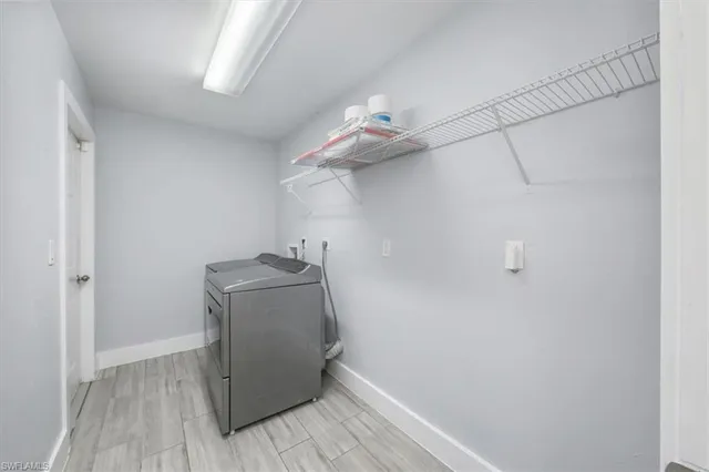 a view of a storage & utility room with wooden floor