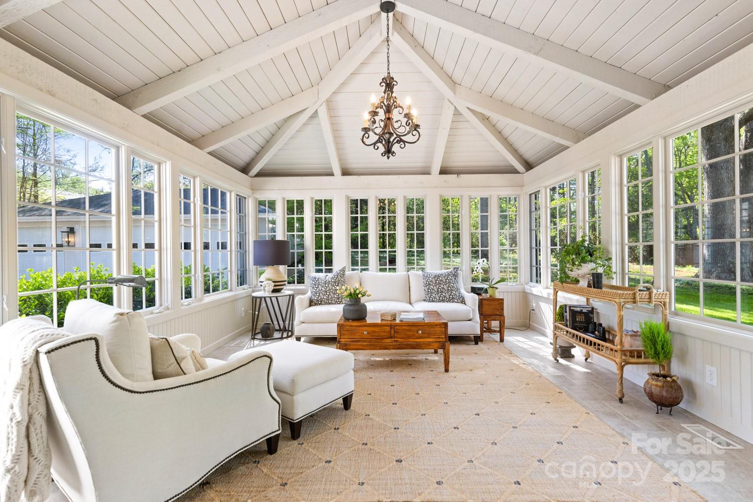 15 Busbee Road Biltmore Forest, NC 28803 - Photo 11 of 24 a living room with furniture and large windows