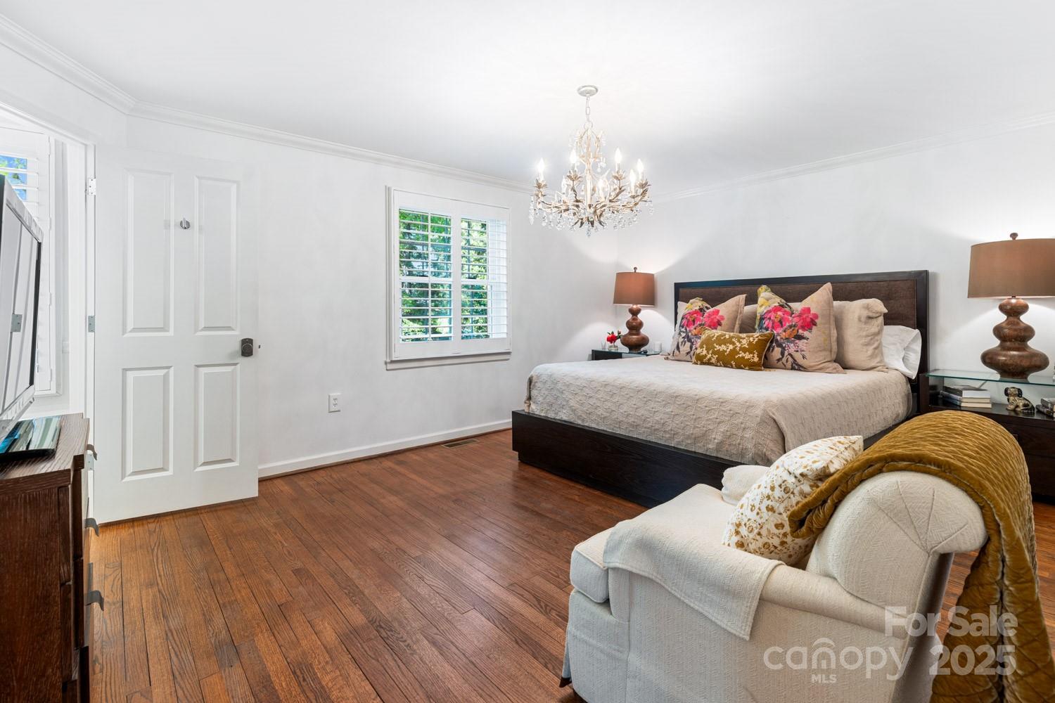 15 Busbee Road Biltmore Forest, NC 28803 - Photo 14 of 24 a bedroom with furniture and wooden floor