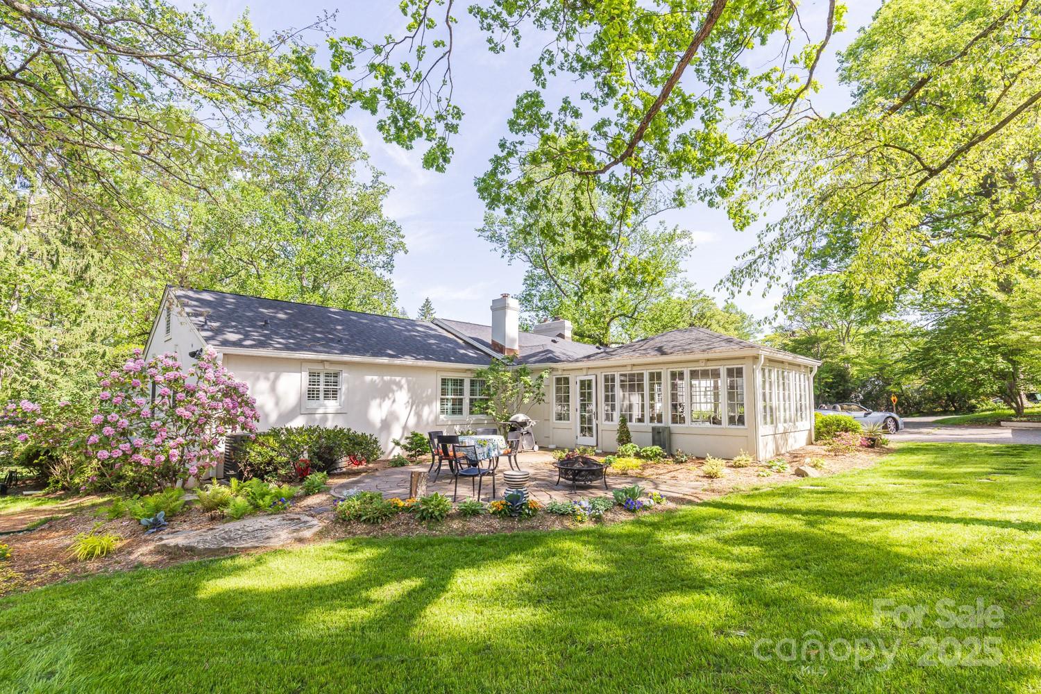 15 Busbee Road Biltmore Forest, NC 28803 - Photo 20 of 24 a front view of a house with garden and swimming pool