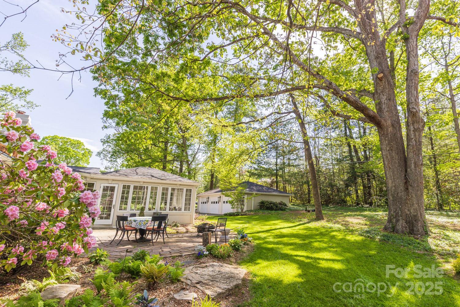 15 Busbee Road Biltmore Forest, NC 28803 - Photo 21 of 24 a front view of house with yard and seating area