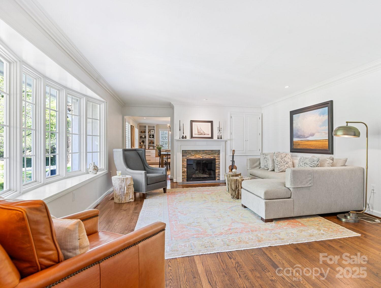 15 Busbee Road Biltmore Forest, NC 28803 - Photo 3 of 24 a living room with furniture fireplace and a large window