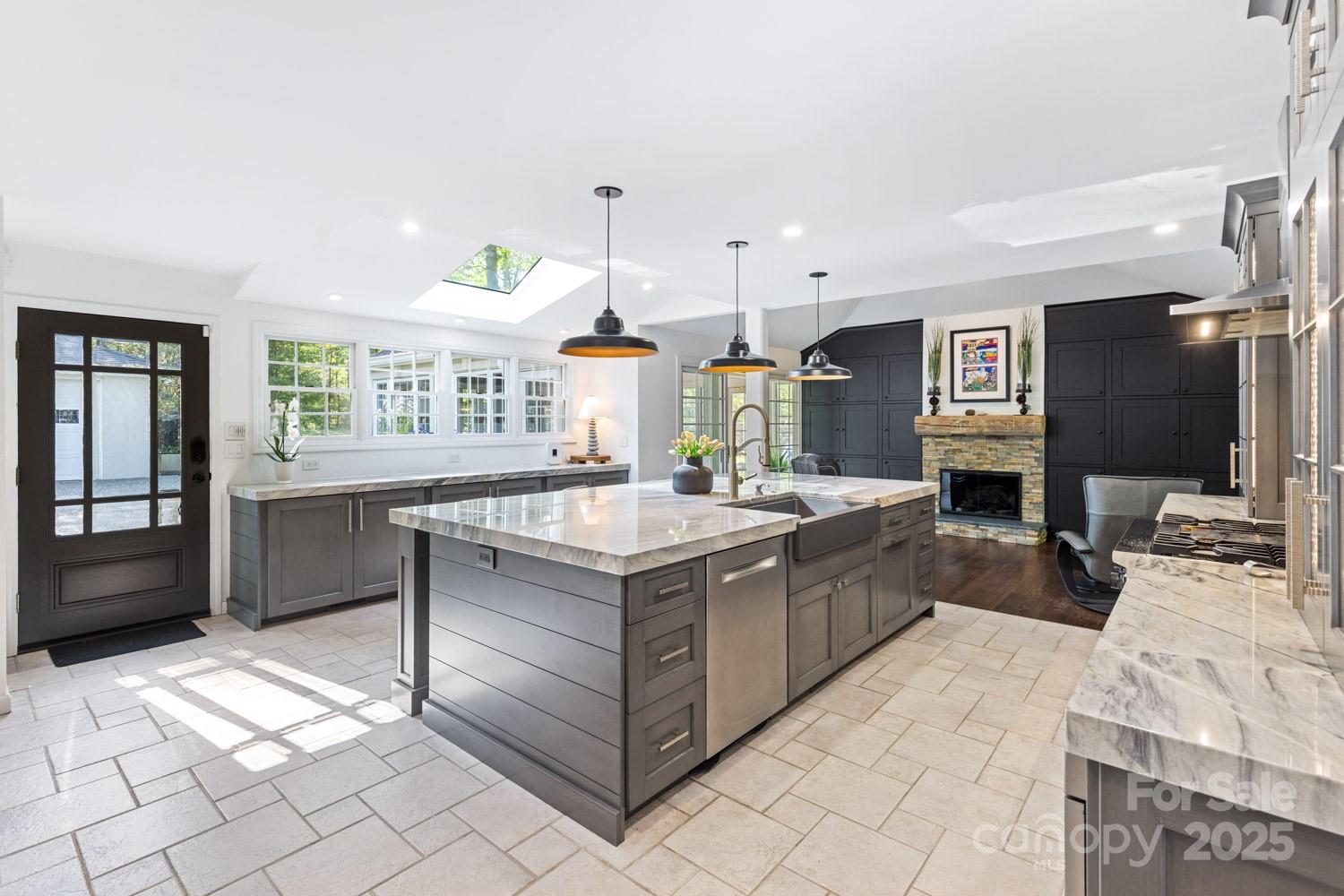 15 Busbee Road Biltmore Forest, NC 28803 - Photo 6 of 24 a kitchen with stainless steel appliances granite countertop a sink and a stove
