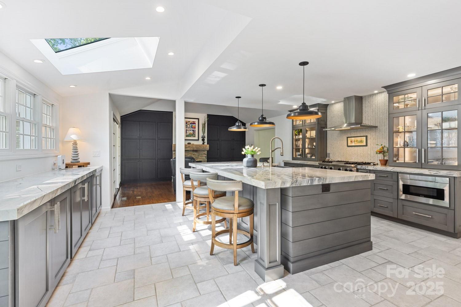 15 Busbee Road Biltmore Forest, NC 28803 - Photo 9 of 24 a large kitchen with a large counter top appliances and cabinets