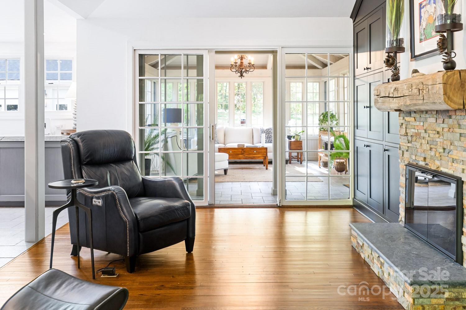 15 Busbee Road Biltmore Forest, NC 28803 - Photo 10 of 24 a living room with furniture and a floor to ceiling window