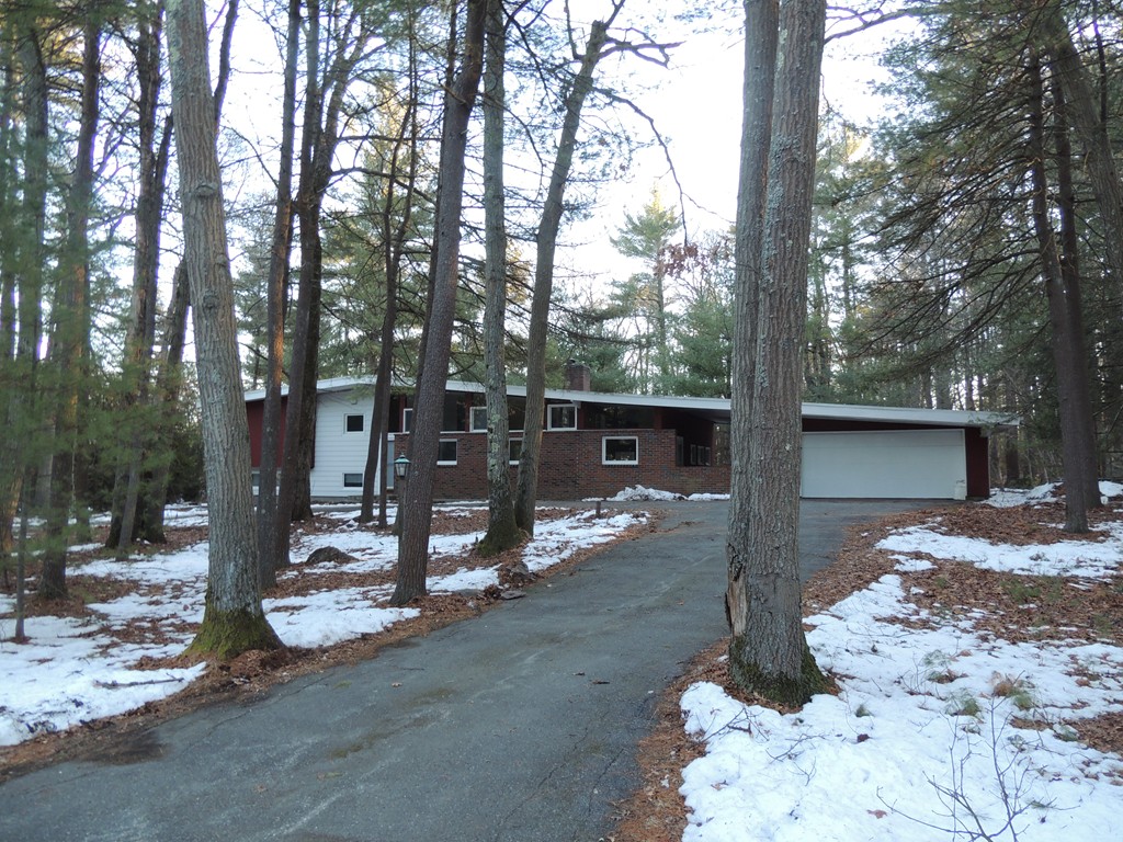 25 Algonquin Road Canton, MA 02021 - Photo 1 of 9 a view of a house with large tree and covered with snow