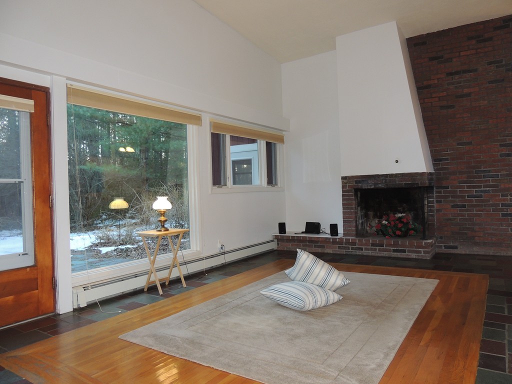 25 Algonquin Road Canton, MA 02021 - Photo 5 of 9 a room with furniture and a fireplace