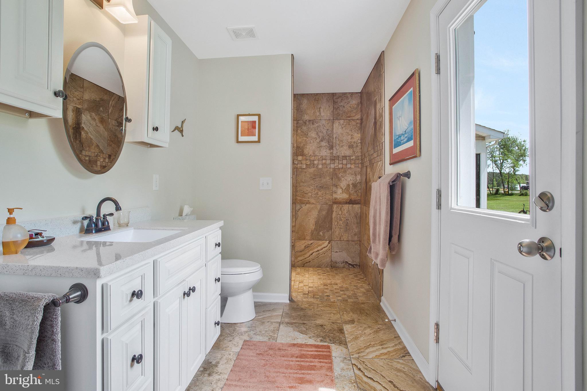 124 Little Neck Road Stevensville, MD 21666 - Photo 27 of 54 Primary bath with exterior door