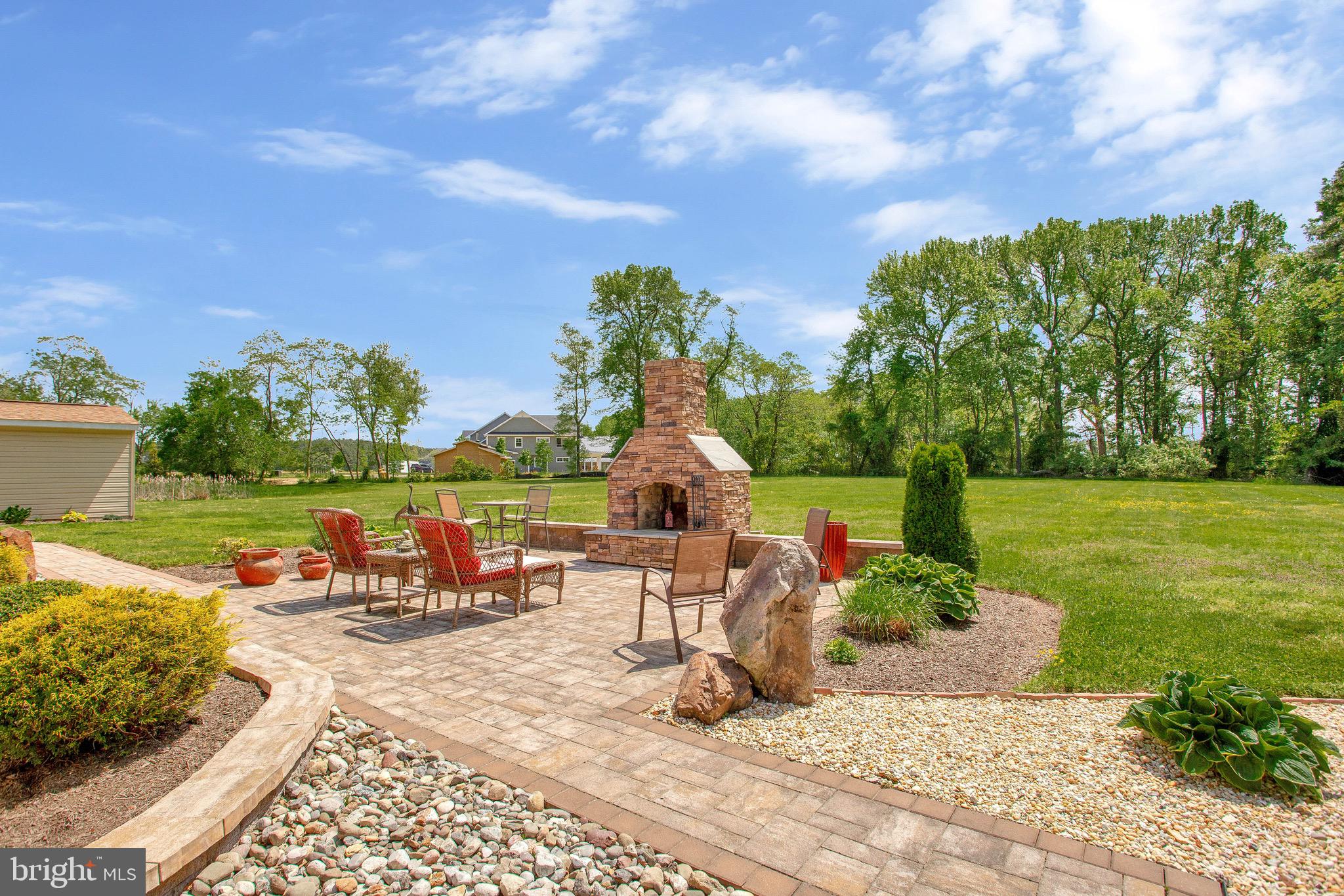 124 Little Neck Road Stevensville, MD 21666 - Photo 43 of 54 Backyard fireplace