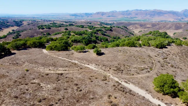 an aerial view of mountain with beach