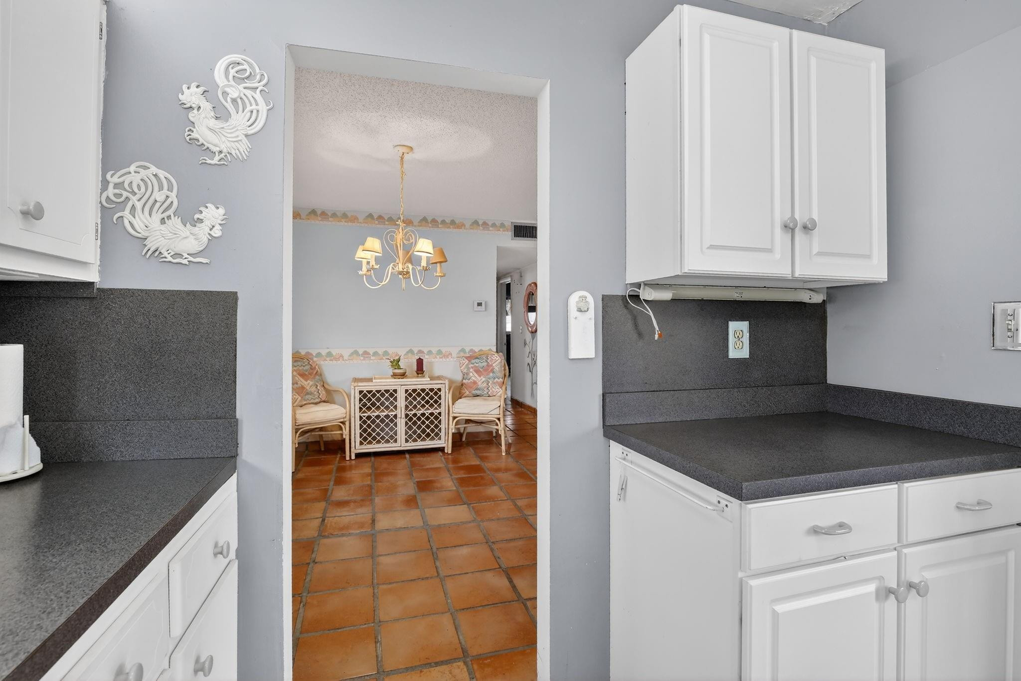 5300 Washington Street, Unit I201 Hollywood, FL 33021 - Photo 11 of 35 a kitchen with granite countertop a sink a stove and cabinets