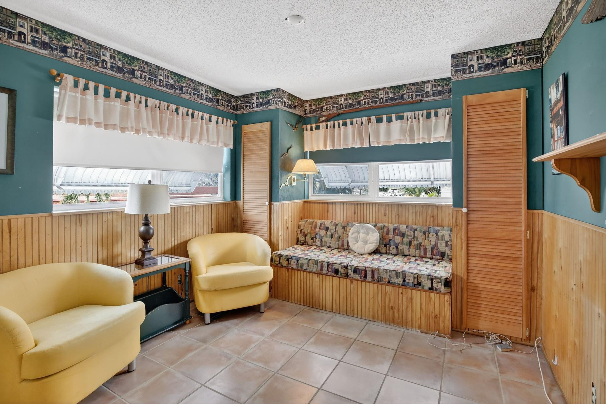 5300 Washington Street, Unit I201 Hollywood, FL 33021 - Photo 18 of 35 a living room with furniture and a large window