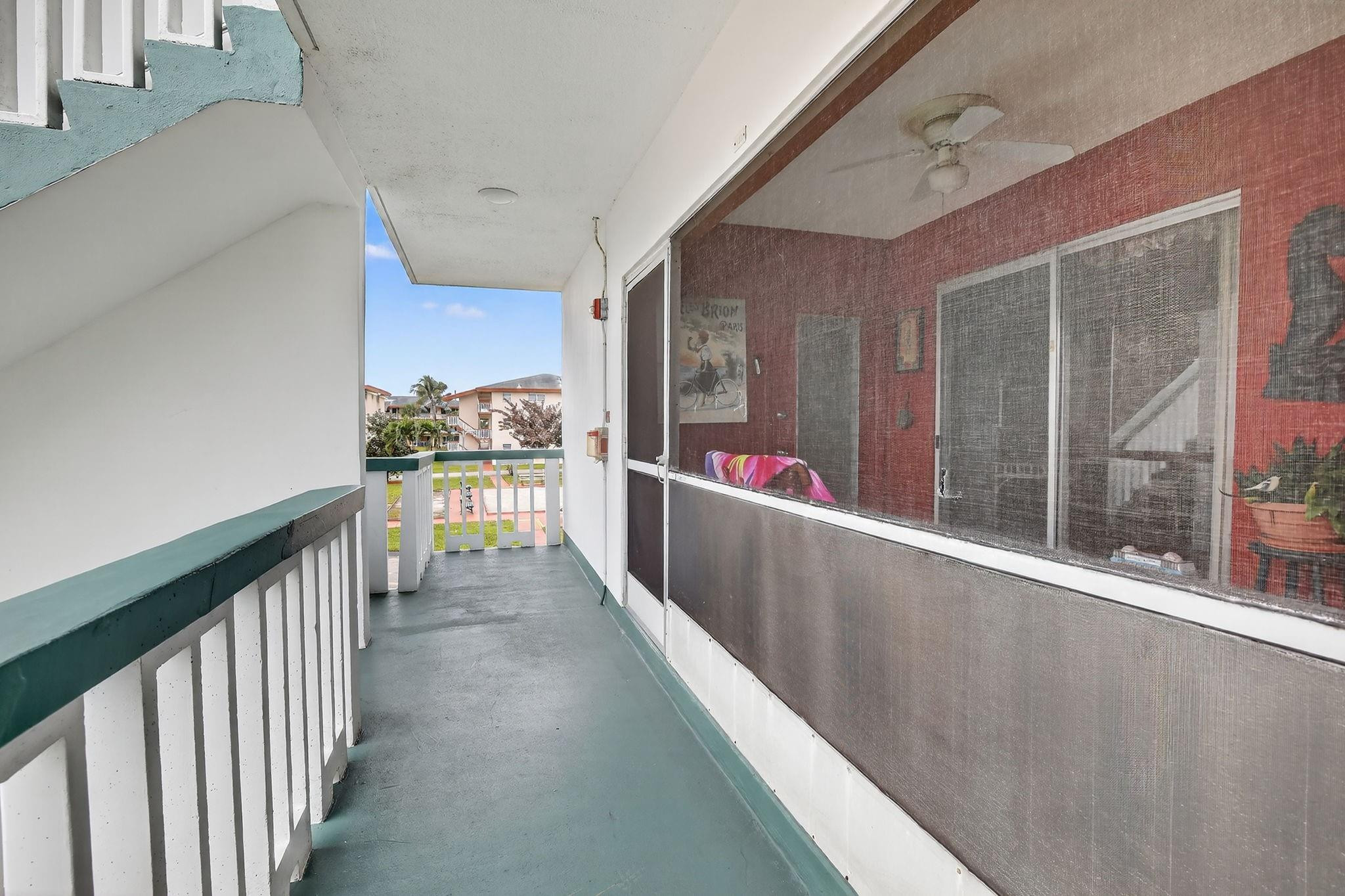 5300 Washington Street, Unit I201 Hollywood, FL 33021 - Photo 28 of 35 a view of a hallway with a dining table and chairs