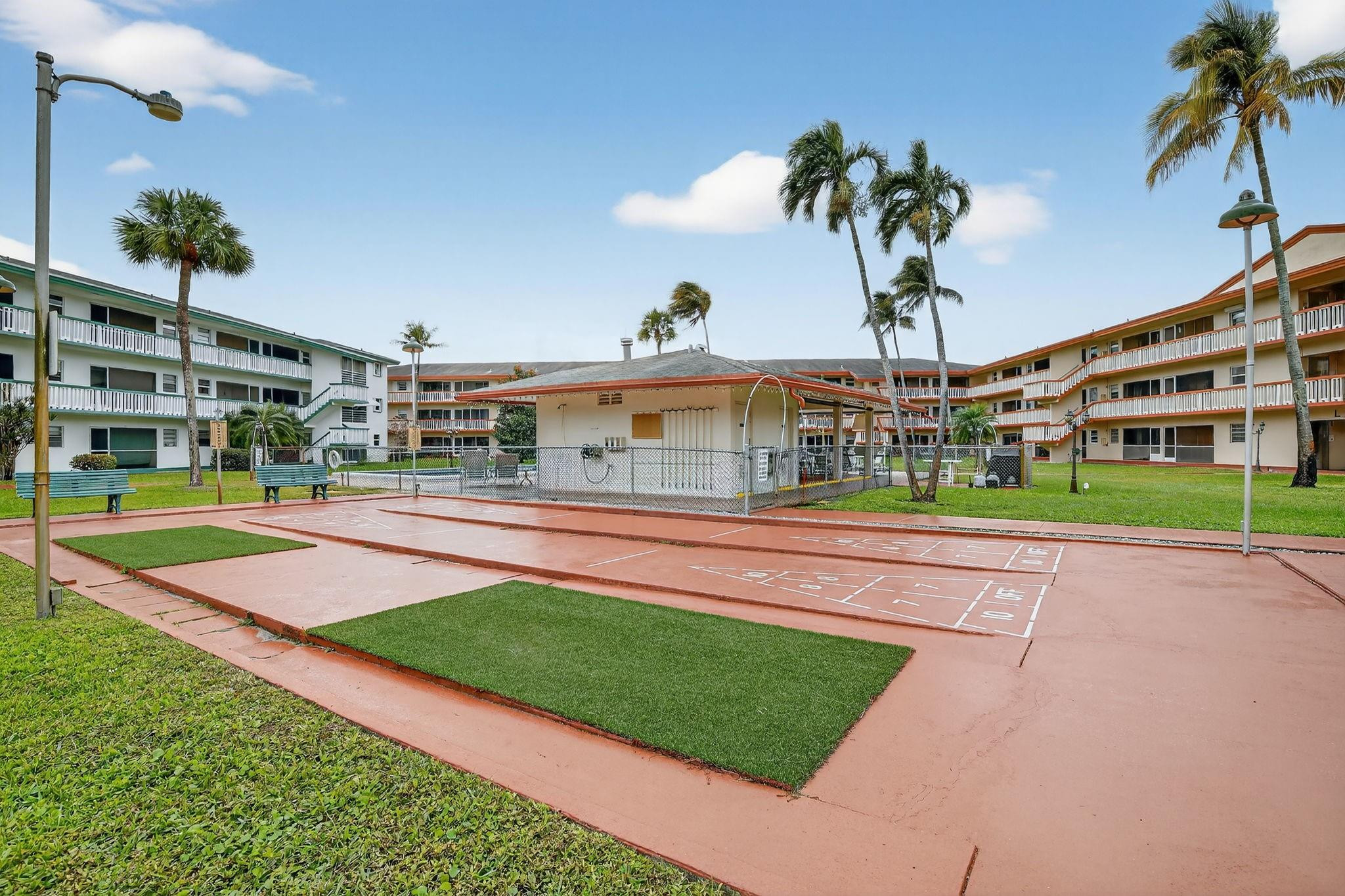 5300 Washington Street, Unit I201 Hollywood, FL 33021 - Photo 31 of 35 a view of a swimming pool with a yard