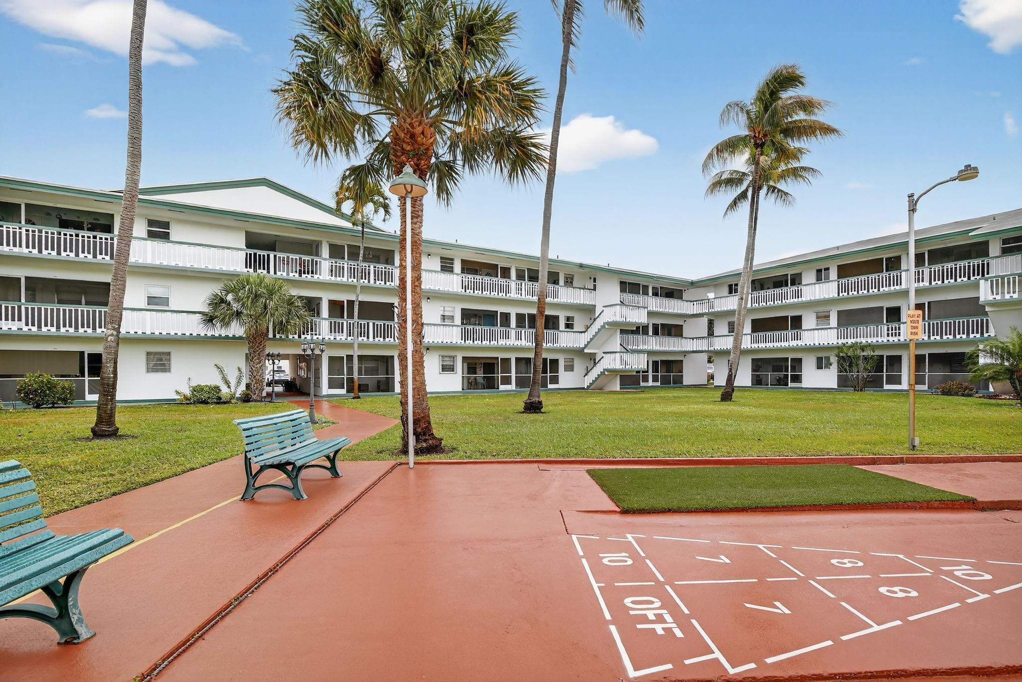 5300 Washington Street, Unit I201 Hollywood, FL 33021 - Photo 32 of 35 a view of a building with a yard