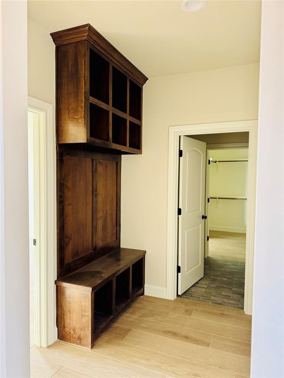 245 Indian Ridge Road Tuscola, TX 79562 - Photo 11 of 21 Mudroom with light wood-style floors and baseboards