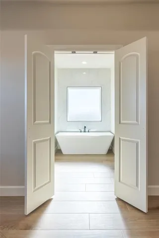 a view of bedroom with furniture and a window