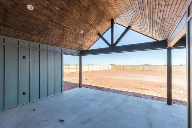 a view of an empty room with a ocean view