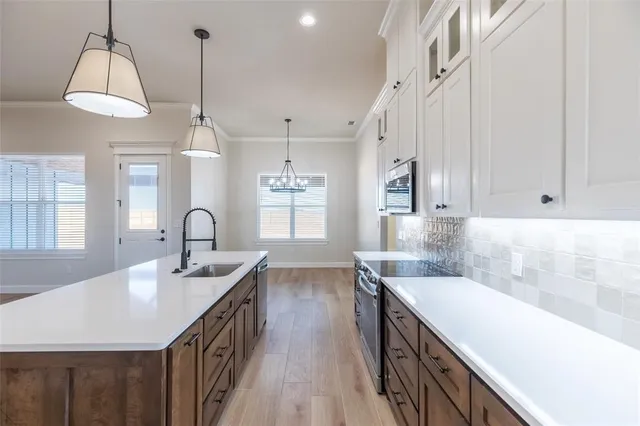 a spacious bathroom with double vanity and a bathtub