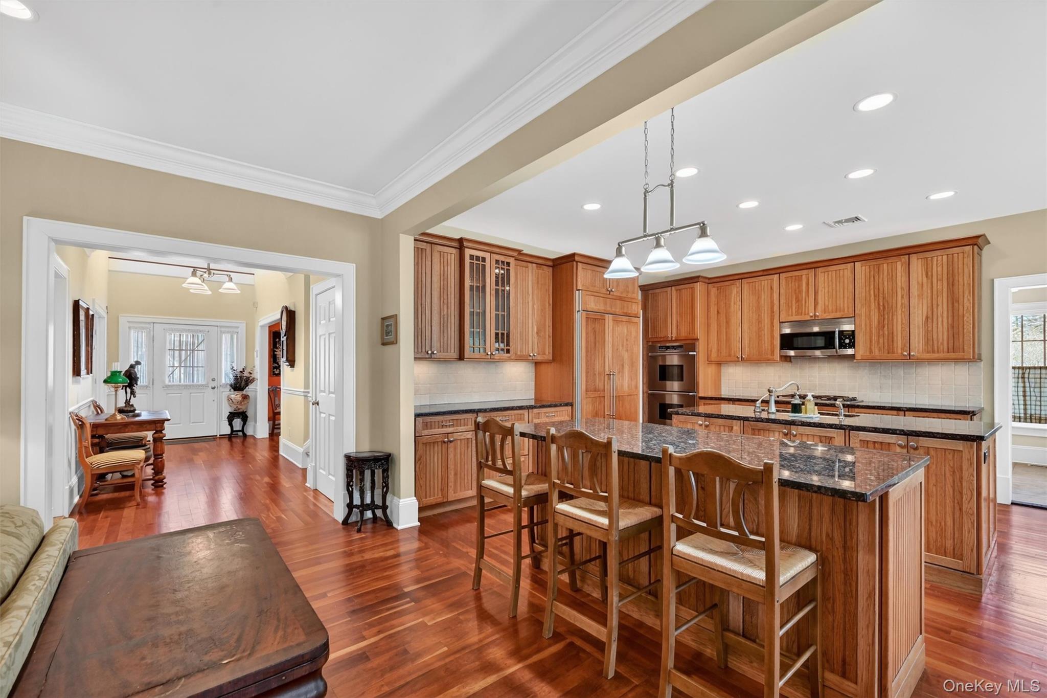 3 Clinton Ave Extension Warwick, NY 10990 - Photo 11 of 40 a kitchen with stainless steel appliances granite countertop a stove top oven a sink dishwasher and white cabinets with wooden floor