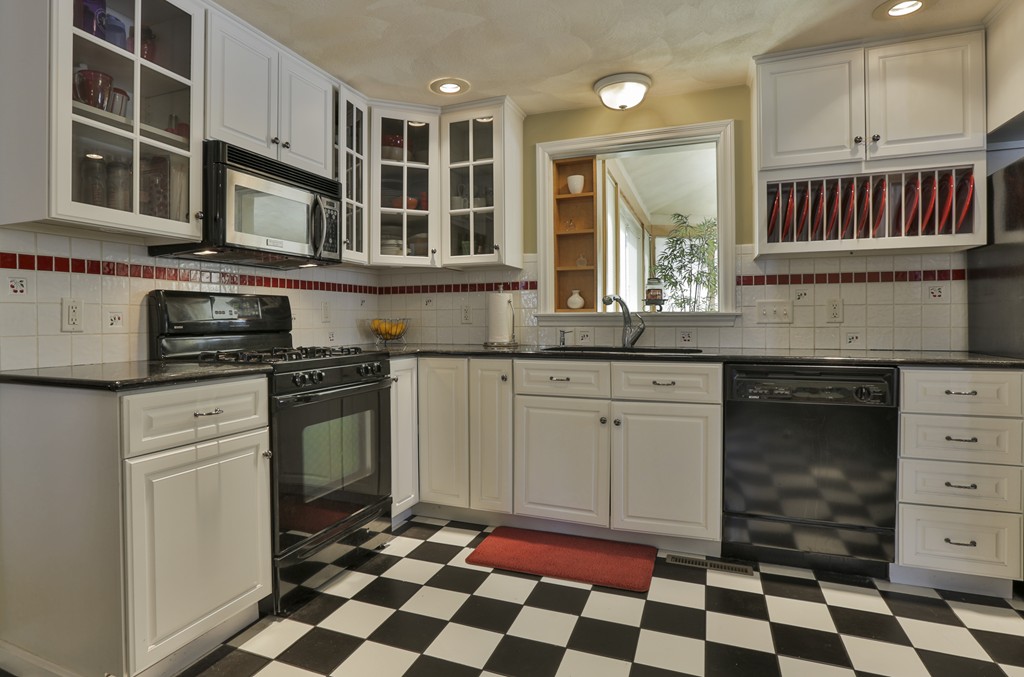 1 Carleton Road Groveland, MA 01834 - Photo 12 of 30 a kitchen with a stove a sink and a cabinets