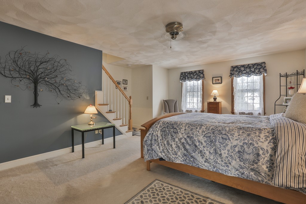1 Carleton Road Groveland, MA 01834 - Photo 24 of 30 a spacious bedroom with a bed and window