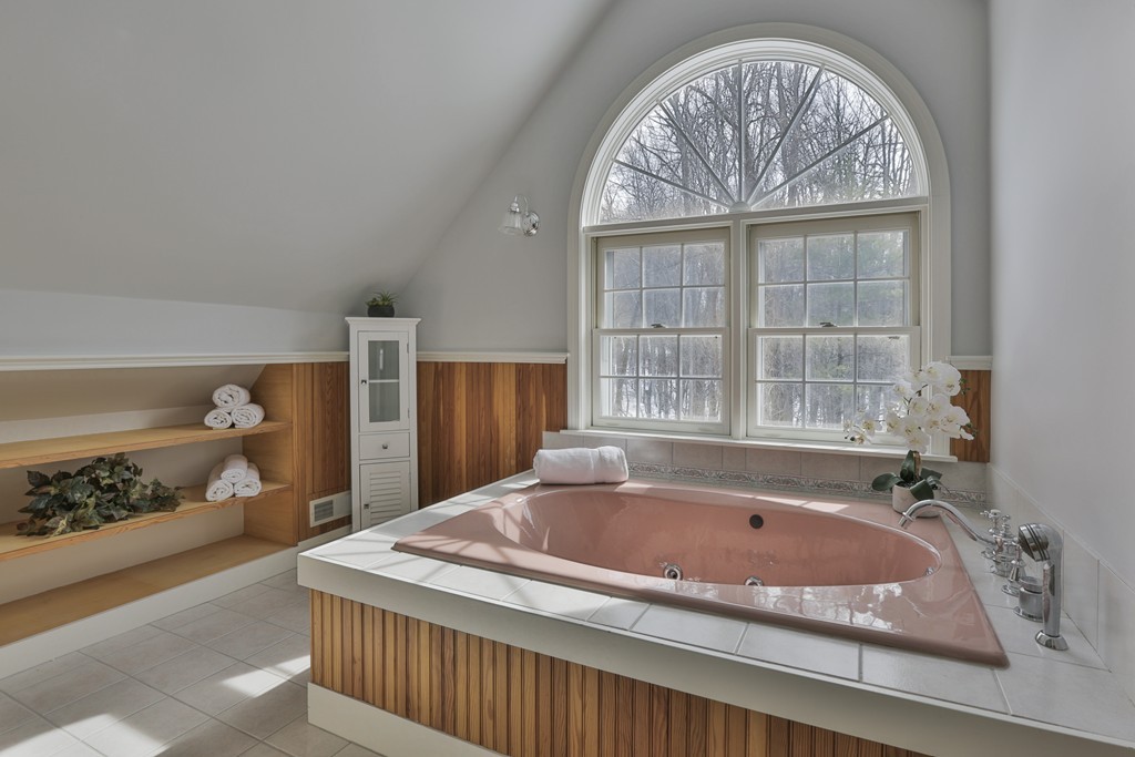 1 Carleton Road Groveland, MA 01834 - Photo 26 of 30 a bath tub sitting in a bathroom next to a window