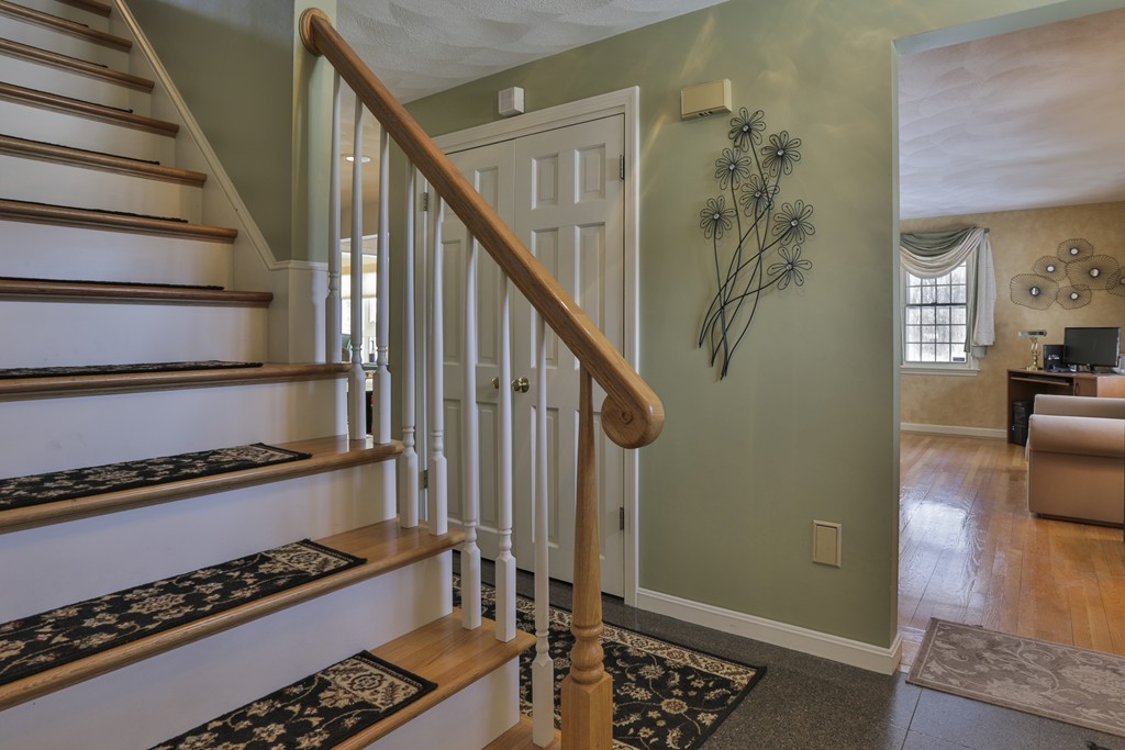 1 Carleton Road Groveland, MA 01834 - Photo 3 of 30 a view of staircase with wooden floor and a rug
