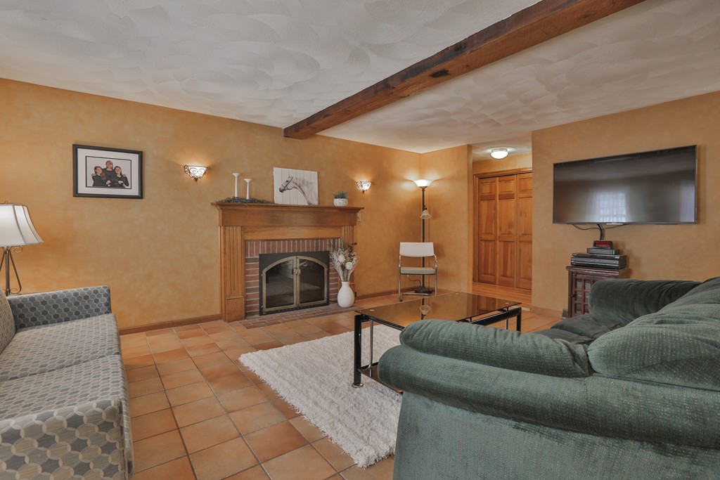 1 Carleton Road Groveland, MA 01834 - Photo 4 of 30 a living room with furniture and a fireplace