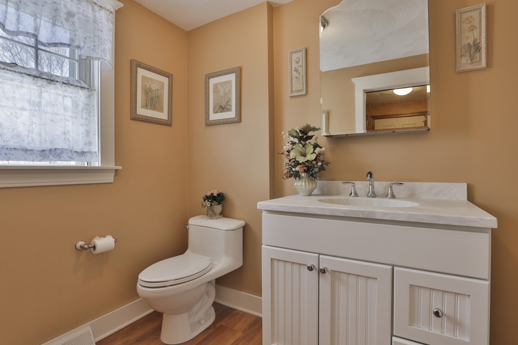 1 Carleton Road Groveland, MA 01834 - Photo 6 of 30 a bathroom with a toilet sink and mirror