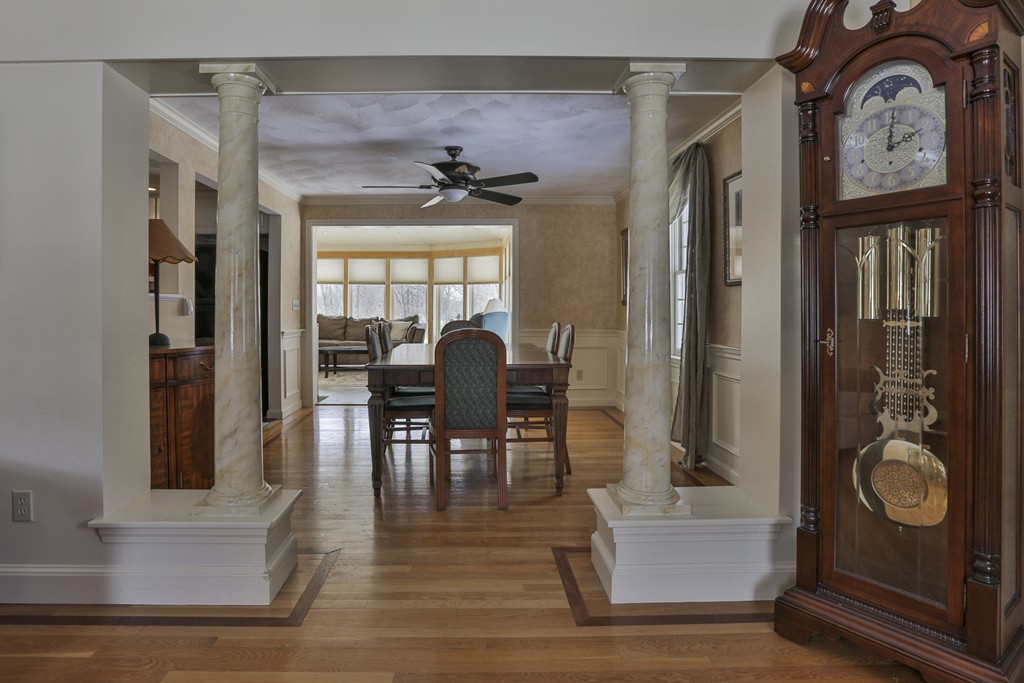1 Carleton Road Groveland, MA 01834 - Photo 9 of 30 a view of a livingroom with furniture wooden floor mirror and windows