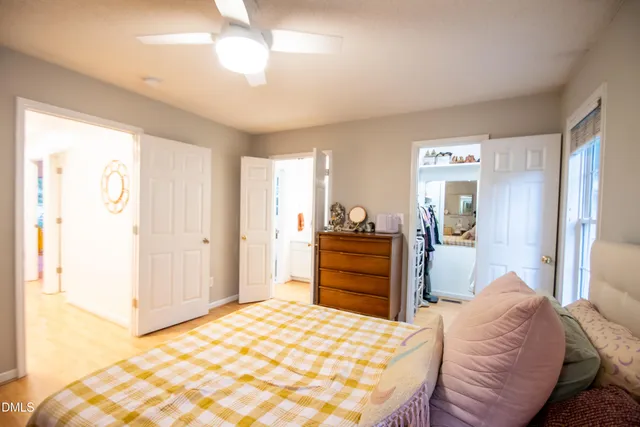 a bedroom with a bed and a dresser