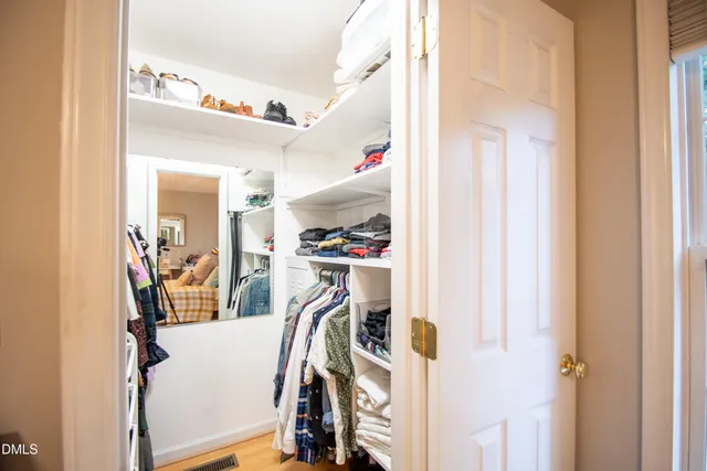 a bedroom with a bed and a chair