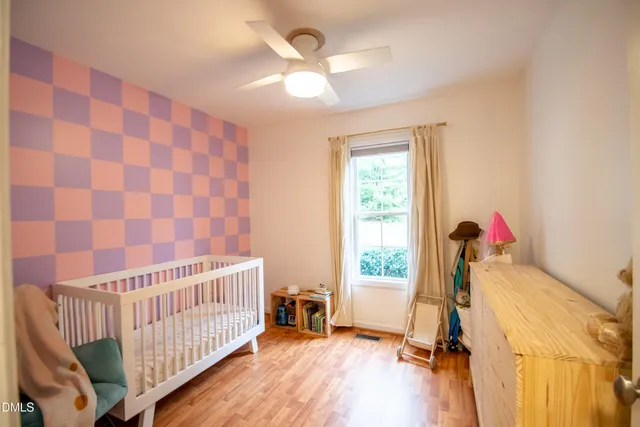 a room with a dresser and a mirror