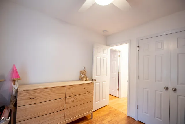 a view of a dining room with furniture and a window