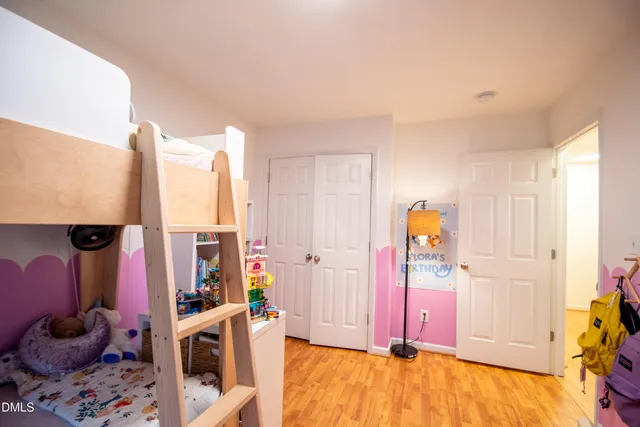a bathroom with a sink a toilet and shower curtain
