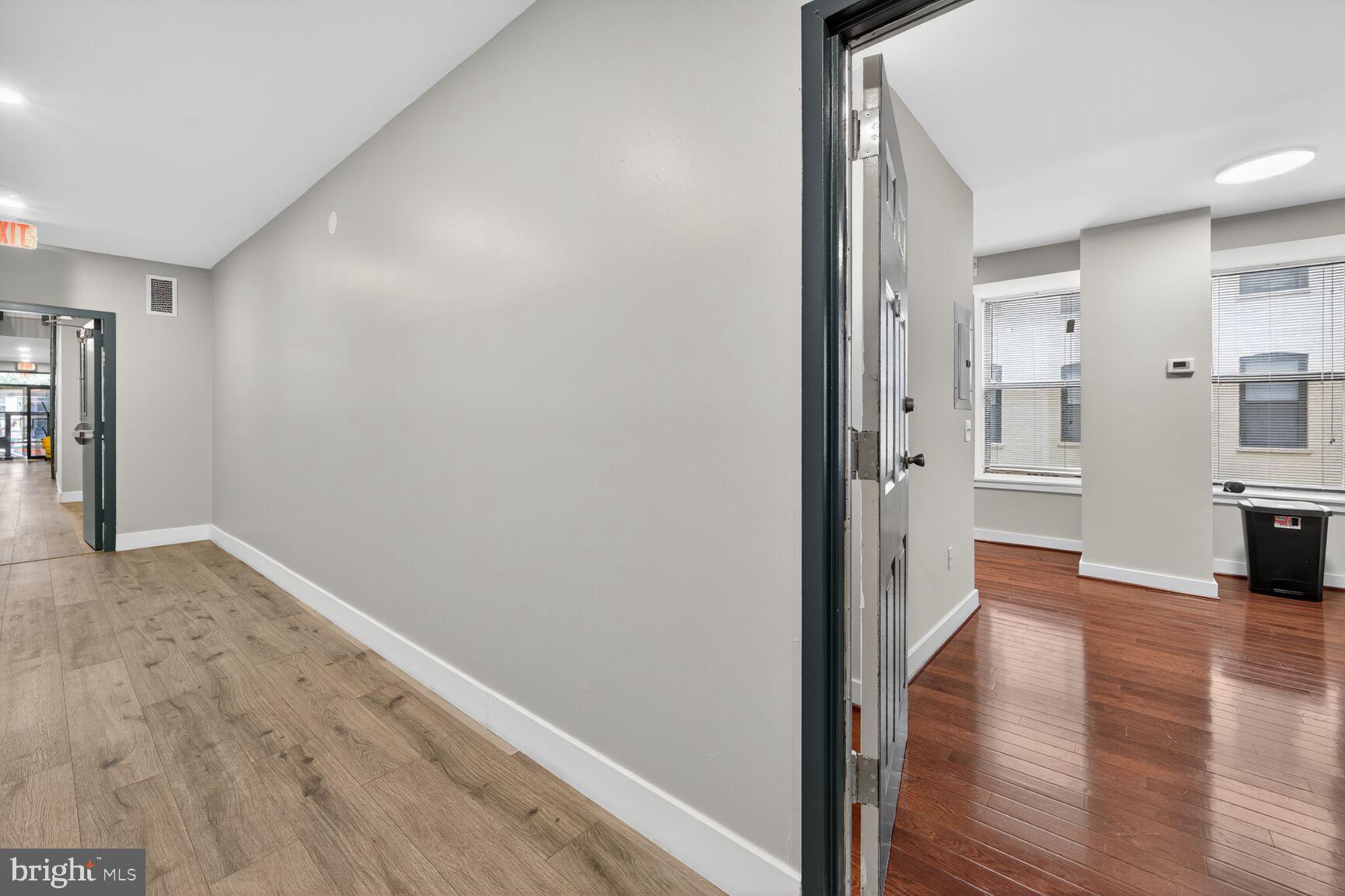 1440 W Street Northwest, Unit 106 Washington, DC 20009 - Photo 14 of 25 a view of a hallway with wooden floor