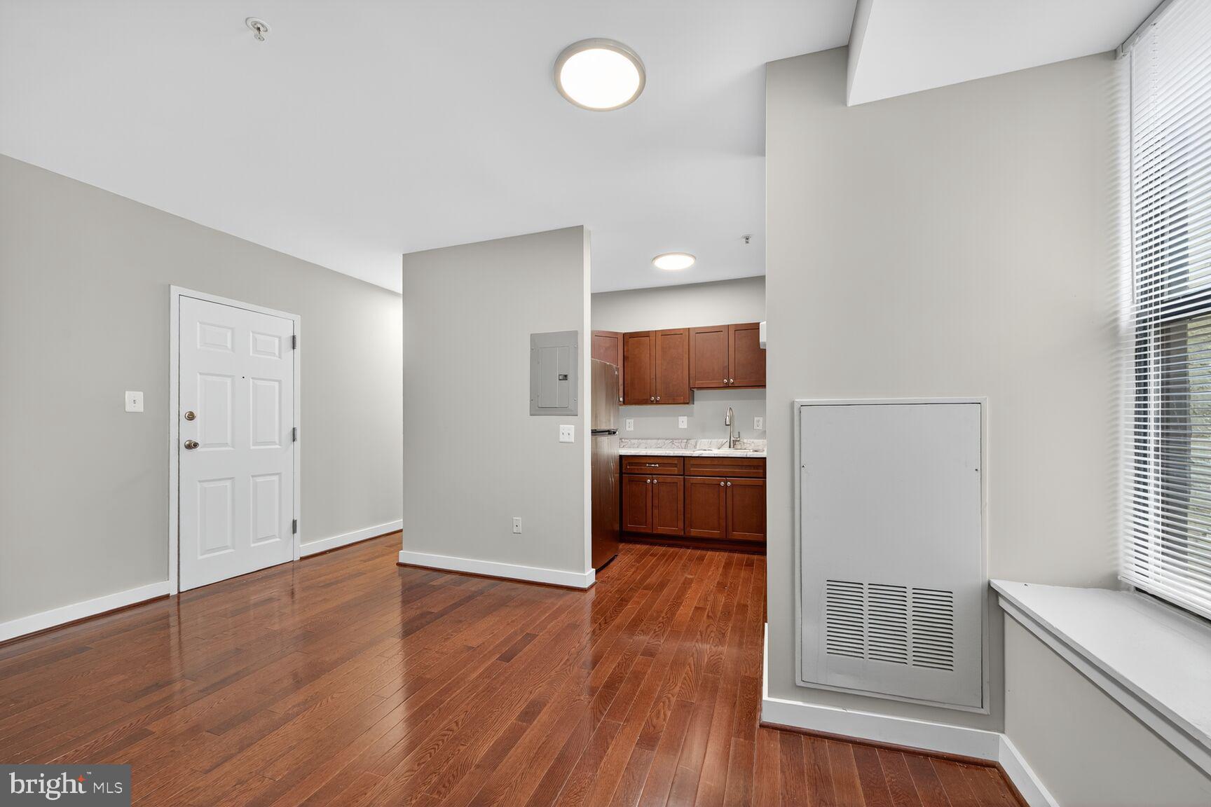 1440 W Street Northwest, Unit 106 Washington, DC 20009 - Photo 5 of 25 a view of kitchen and wooden floor